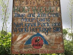 09A Welcome to Holywell, Blue and John Crow Mountains National Park and World Heritage Site, The Blue Mountains Experience sign near Kingston Jamaica